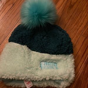 Variety of blue colors on this Justice beanie. Never worn. Tag on.
